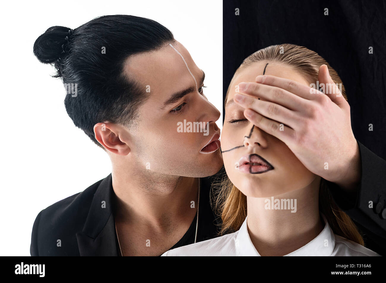 Beautiful Colleague Black Haired Man With Hair Bun Looking At His