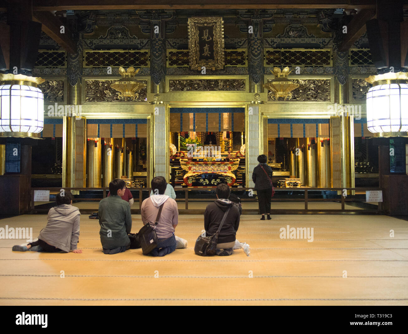 People praying in a hall at Nishi Hongan-ji in Kyoto, Japan. This ...