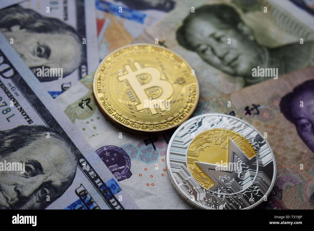 Bitcoin BTC and Monero XMR Coins on Chinese Yuan and US dollar banknotes.  Close-up Stock Photo - Alamy