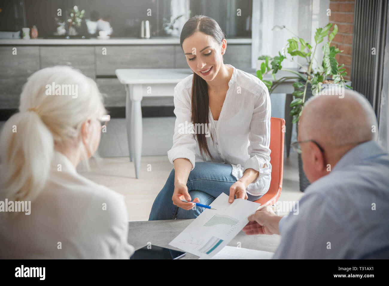 Senior couple planning their investments with financial advisor Stock Photo