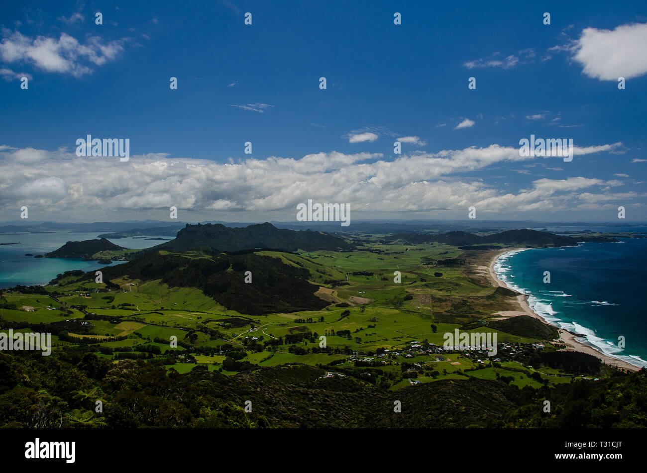Coastline view from the top of Te Whara Track with blue sky above in Whangarei Heads, Northland, New Zealand. Stock Photo