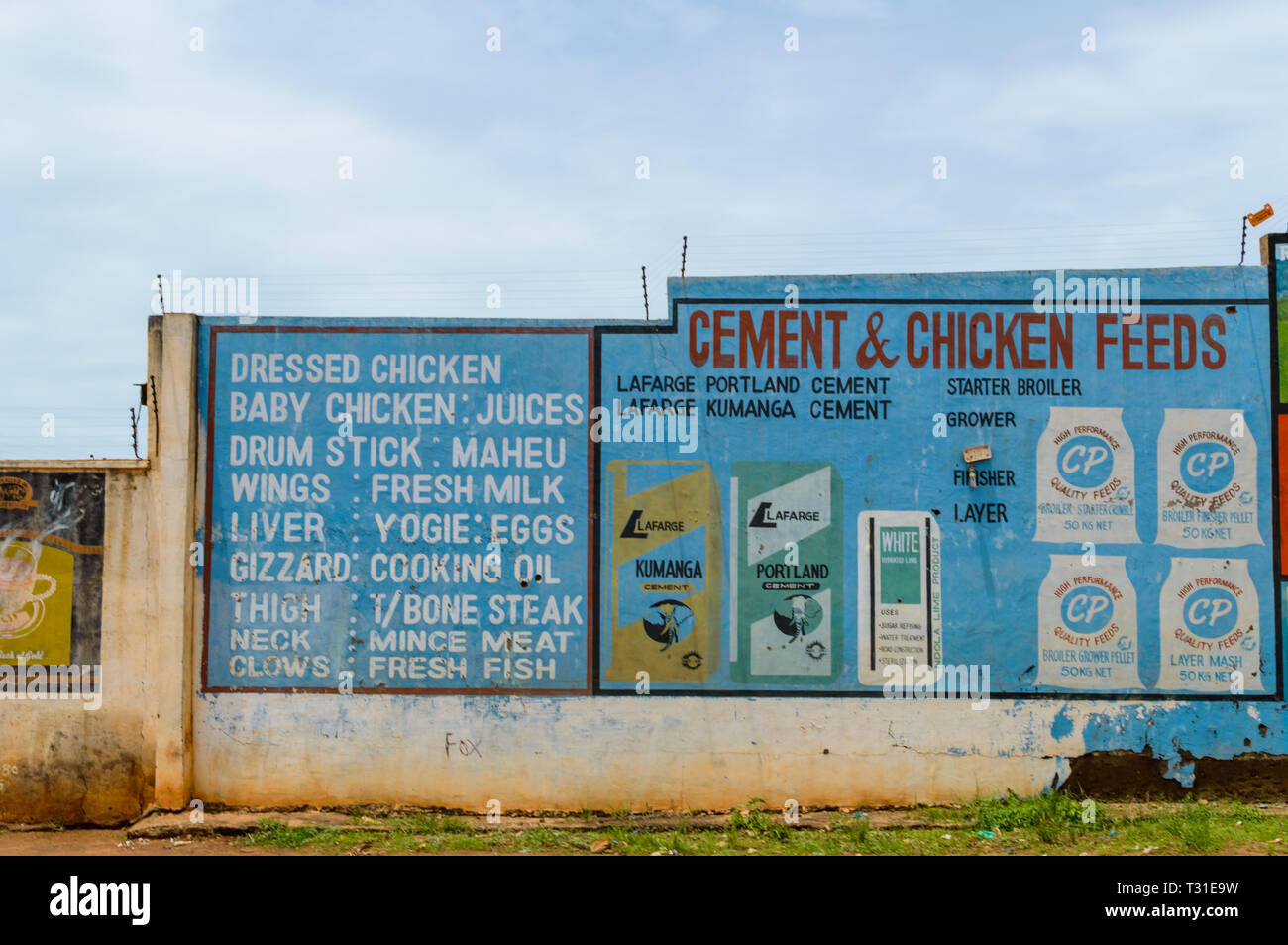 advertisements painted on wall of compound within Lilongwe Malawi. Stock Photo