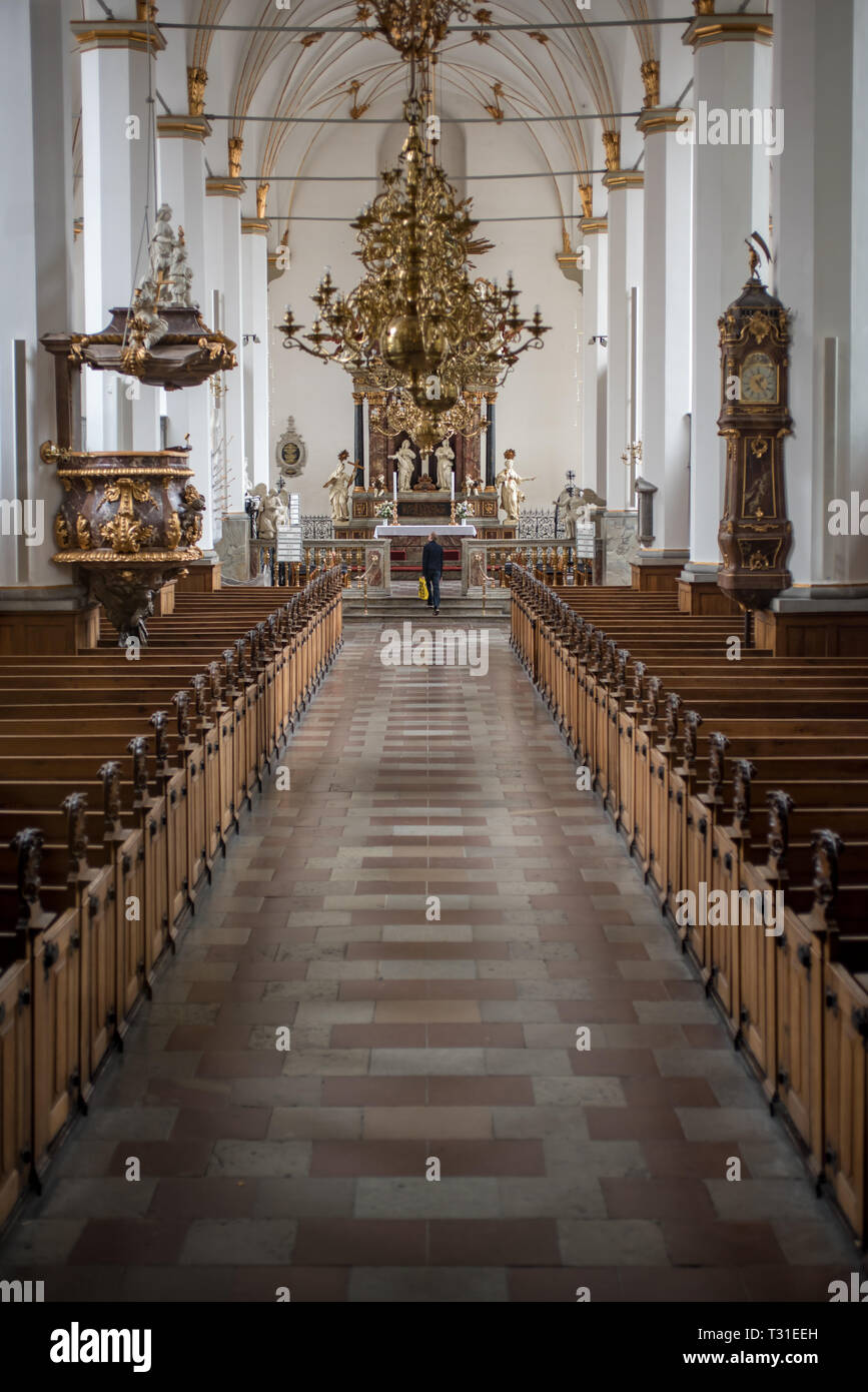 The interior of the Baroque inspired Trinitas Kirke in Copenhagen with its flamboyant altar and pulpit by wood-carver Friedrich Ehbisch Stock Photo