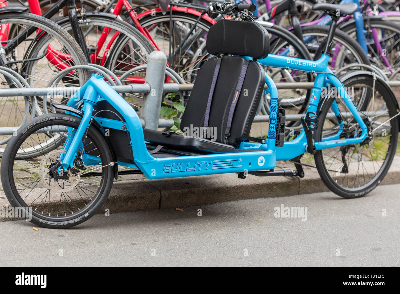 A Larry vs Harry Bullitt Bluebird cargo bike fitted with a front passenger seat. This unusual bicycle is designed and made in Copenhagen Stock Photo