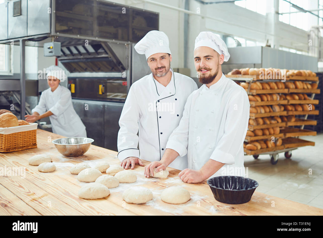 Men bakers in the workplace in the bakery Stock Photo Alamy