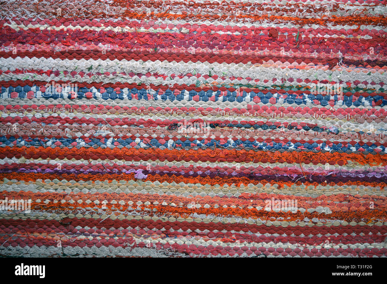 old knitted colorful carpet abstract background and texture Stock Photo
