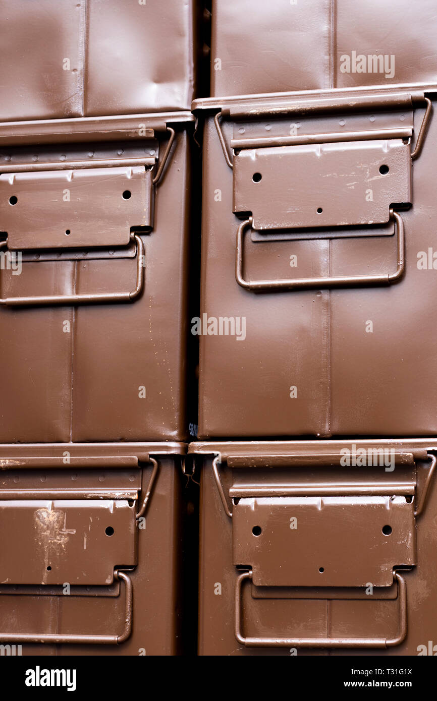 stacked brown ammunition boxes designed for the safe transportation of bullets, shells and explosive items Stock Photo