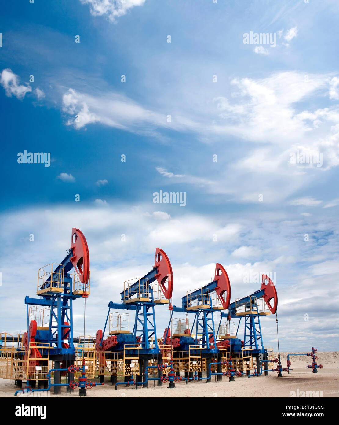 Oil industry and gas industry. Oil equipment. Blue sky and white clouds Stock Photo Alamy