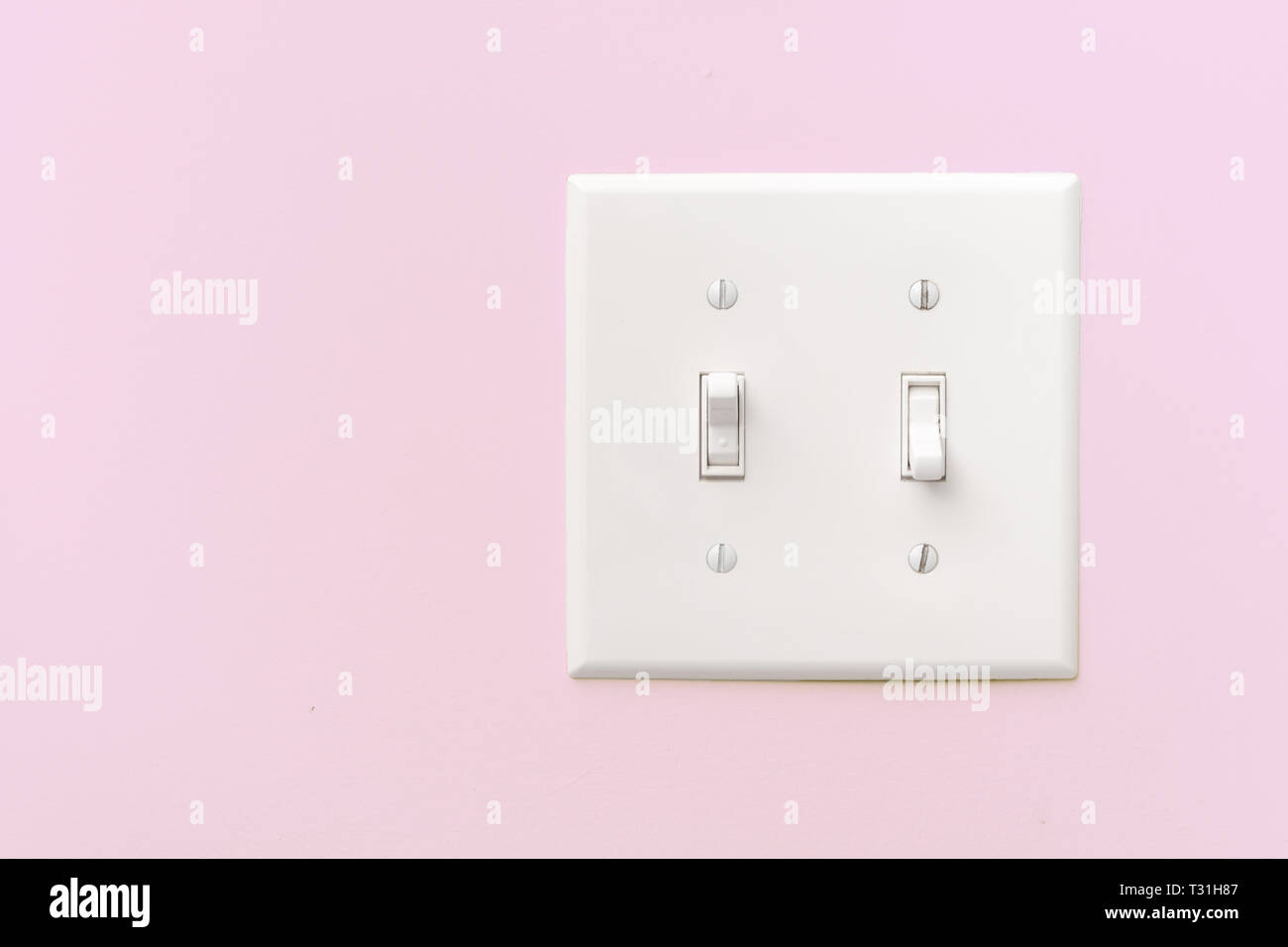 Interior light switch on pink wall with copy space Stock Photo Alamy