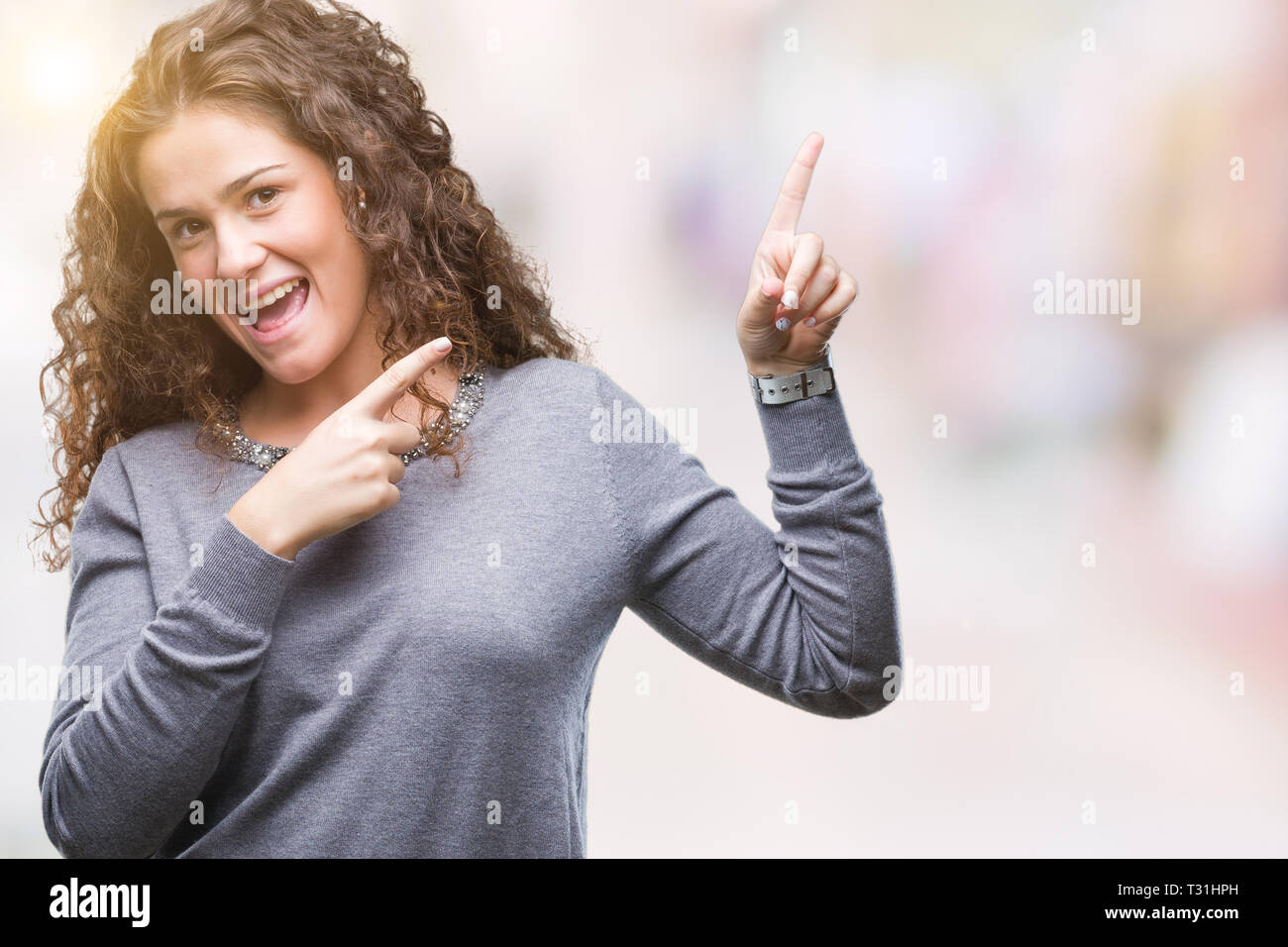 beautiful-brunette-curly-hair-young-girl-wearing-a-sweater-over