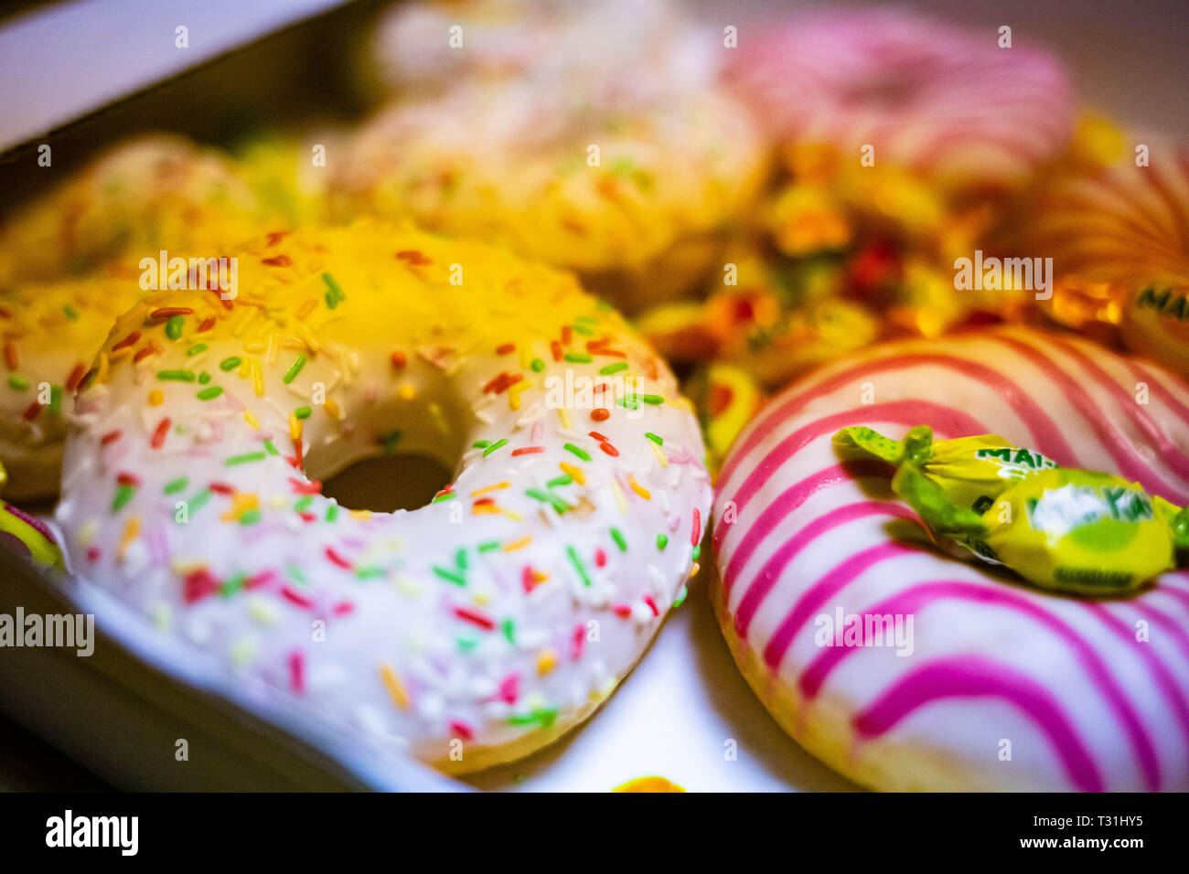 Colored tasty donuts close up sugar food dessert Stock Photo