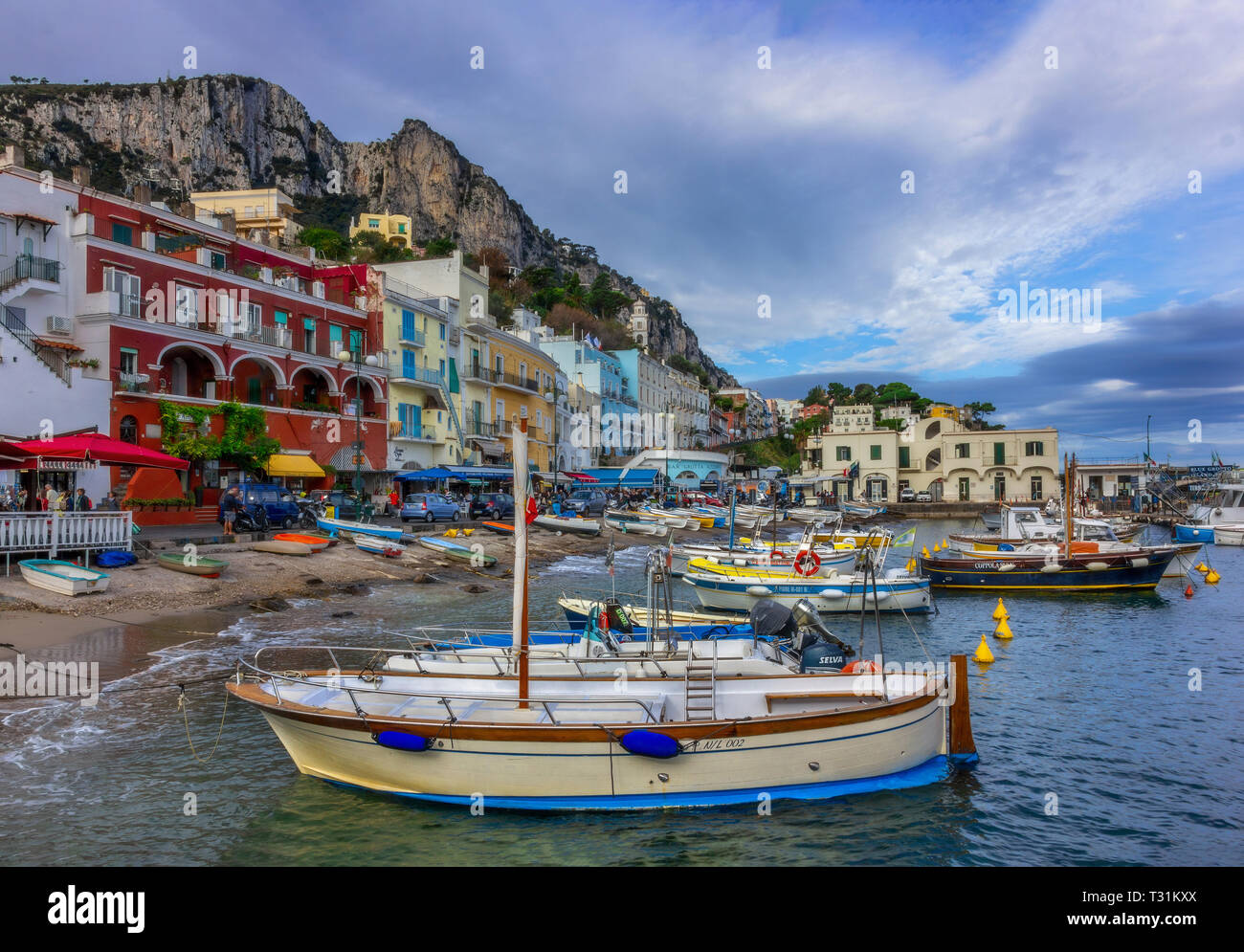 Colourful port of Capri island in Italy.  I took the first ferry from Naples to Capri Island. As a foreigner in Italy I didn't expect  to find so exot Stock Photo