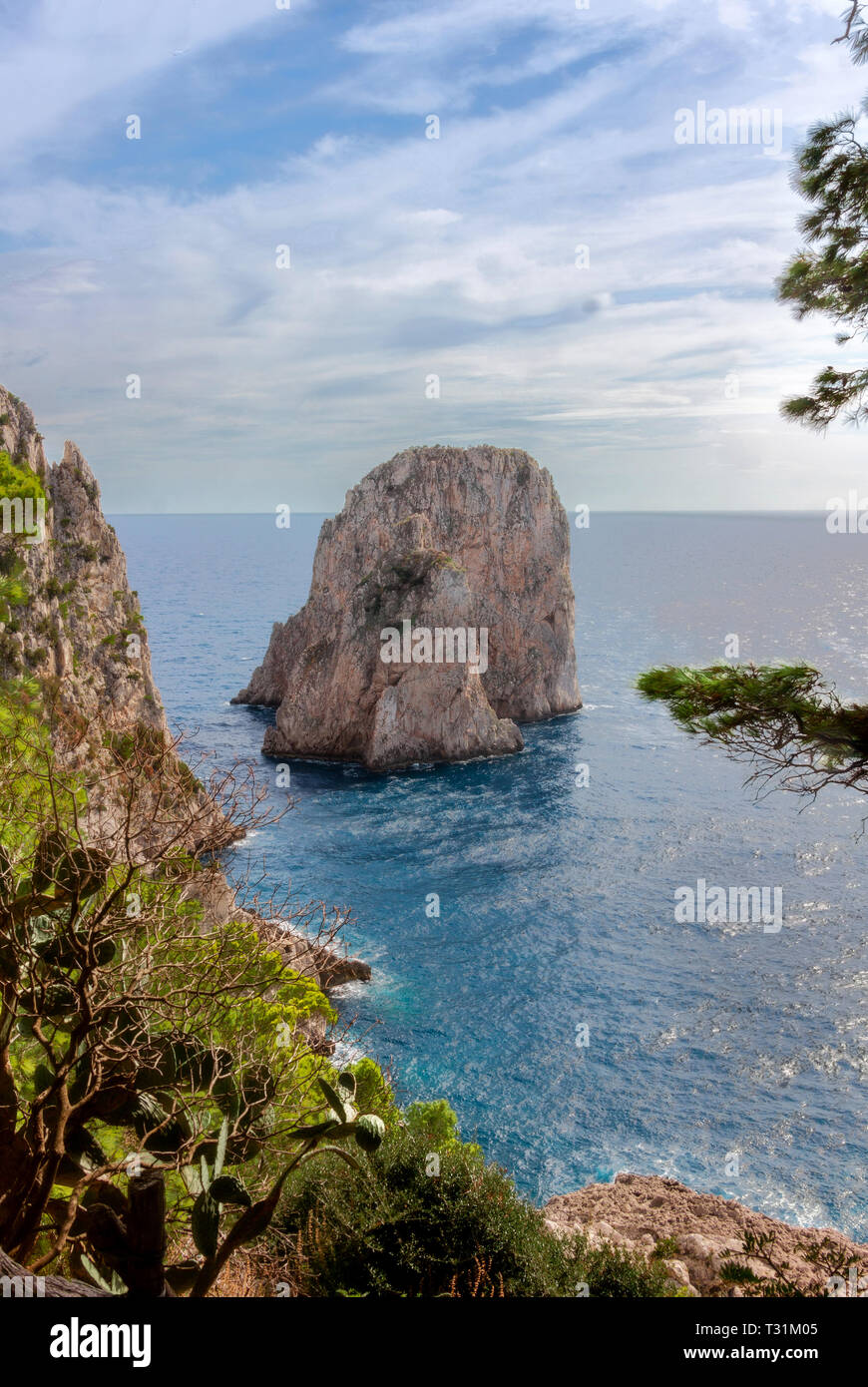 Faraglioni rock on Capri island, Italy. One of magic views in Capri island, close to Naples. By the way, locals say that they have seen sirens on this Stock Photo
