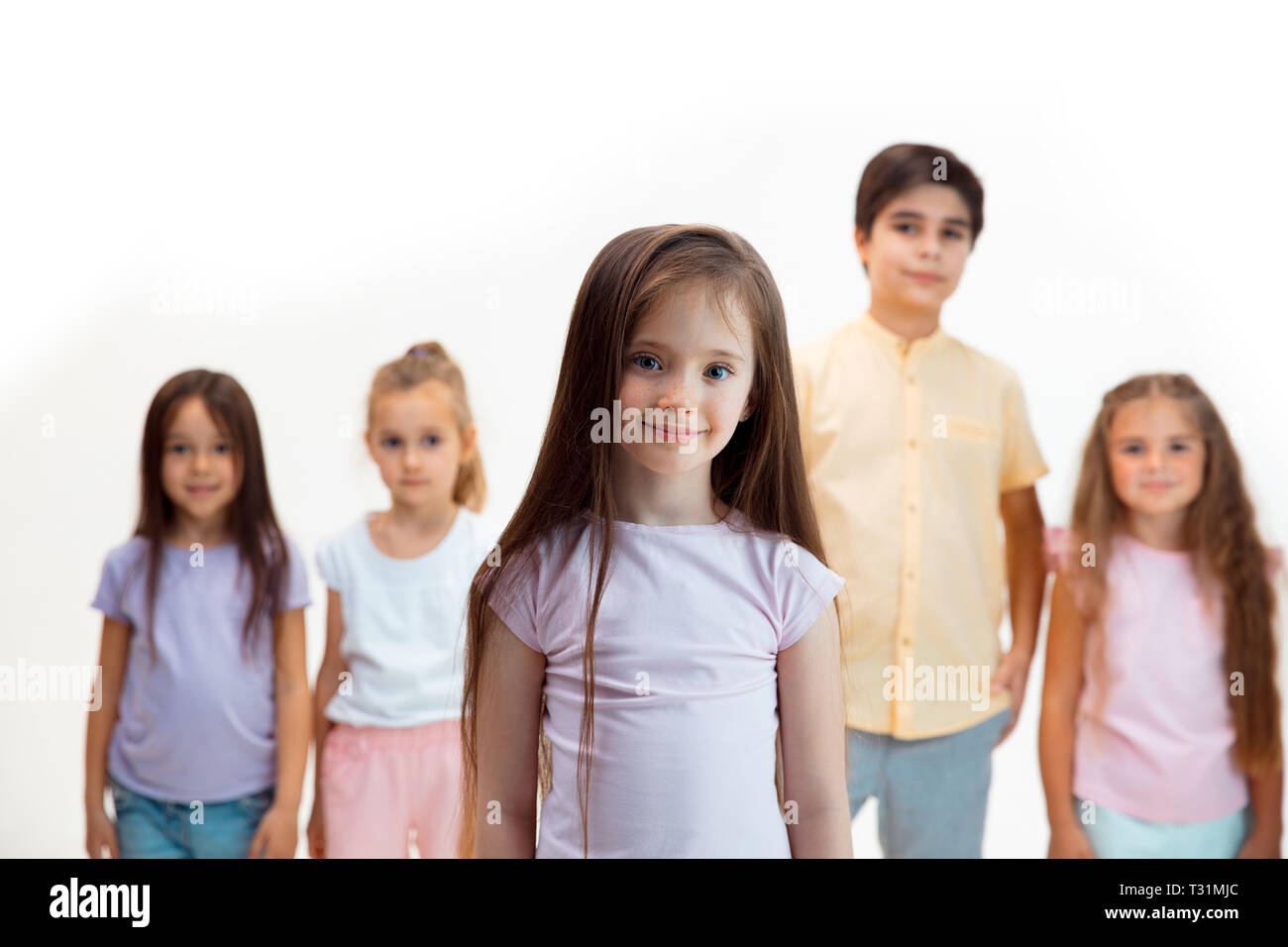 The portrait of happy cute little kids boy and girls in stylish casual ...