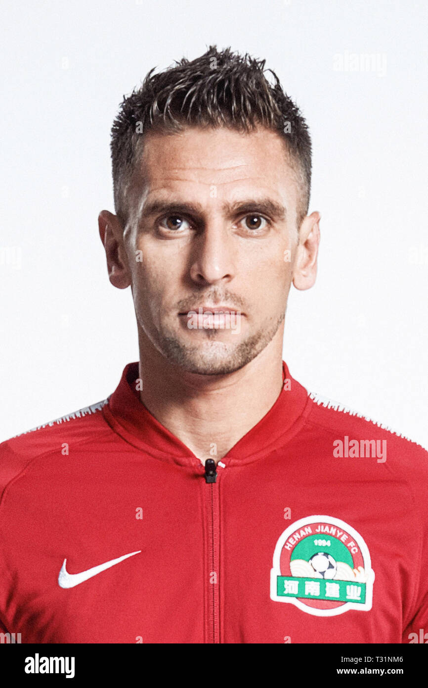 **EXCLUSIVE**Brazilian football player Olivio da Rosa, also known as Ivo, of Henan Jianye F.C. poses during the filming session of official portraits for the 2019 Chinese Football Association Super League, in Foshan city, east China's Guangdong province, 19 February 2019. Stock Photo