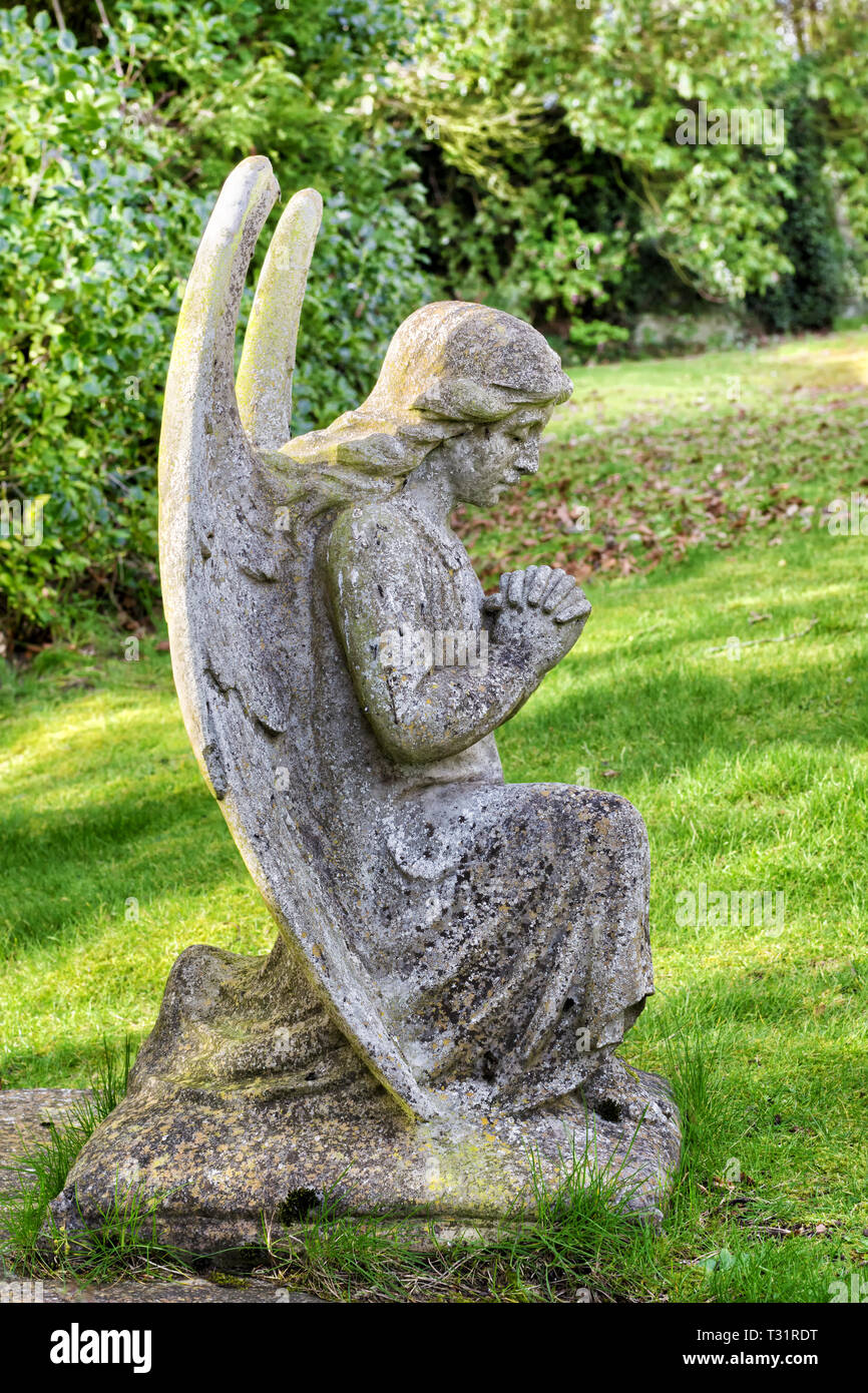 Old statue of angel at a cemetery on Loch Leven shore in Scotland, UK Stock Photo