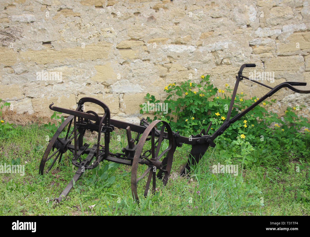 Ancient iron plow tool used in farming for cultivation of soil in preparation for sowing seed