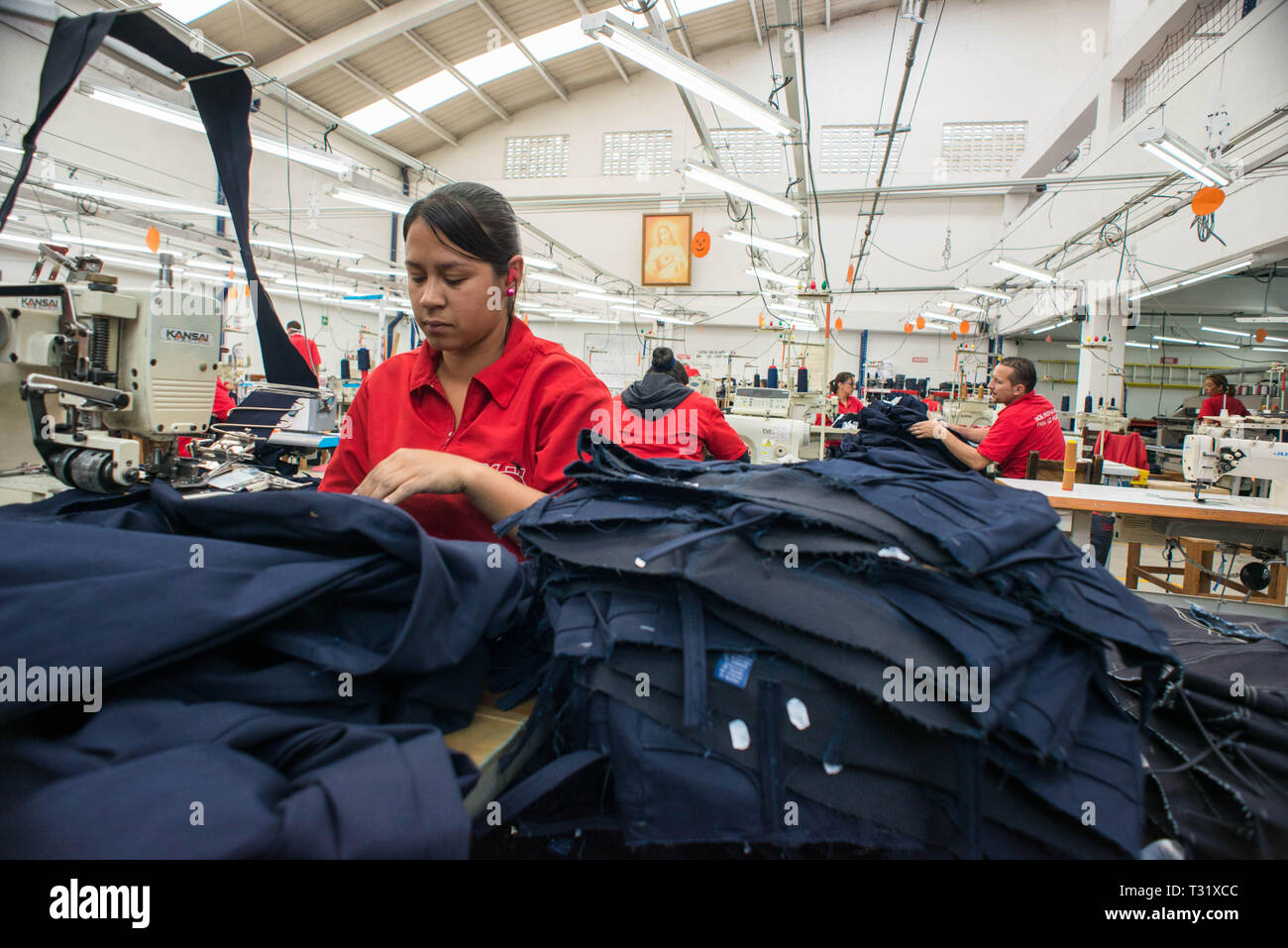 Donmatias, Antioquia, Colombia: Somos Jeans is a factory that produces for its own brand, Square, and for foreign brands such as Diesel in Italy. Stock Photo