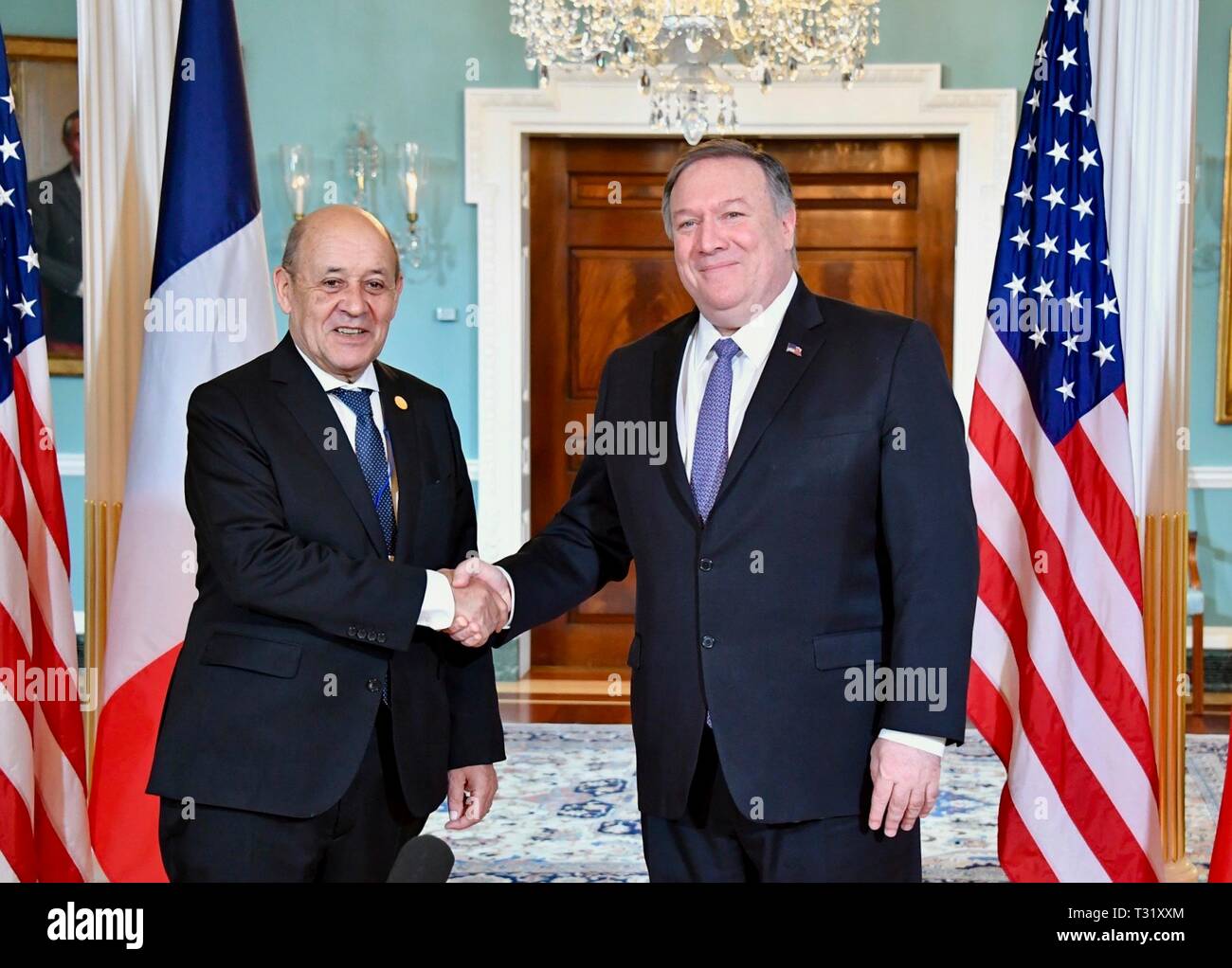 U.S. Secretary of State Mike Pompeo shakes hands with French Foreign Minister Jean-Yves Le Drian following a bilateral meeting on the sidelines of the NATO Ministerial at the State Department April 3, 2019 in Washington, D.C. Stock Photo
