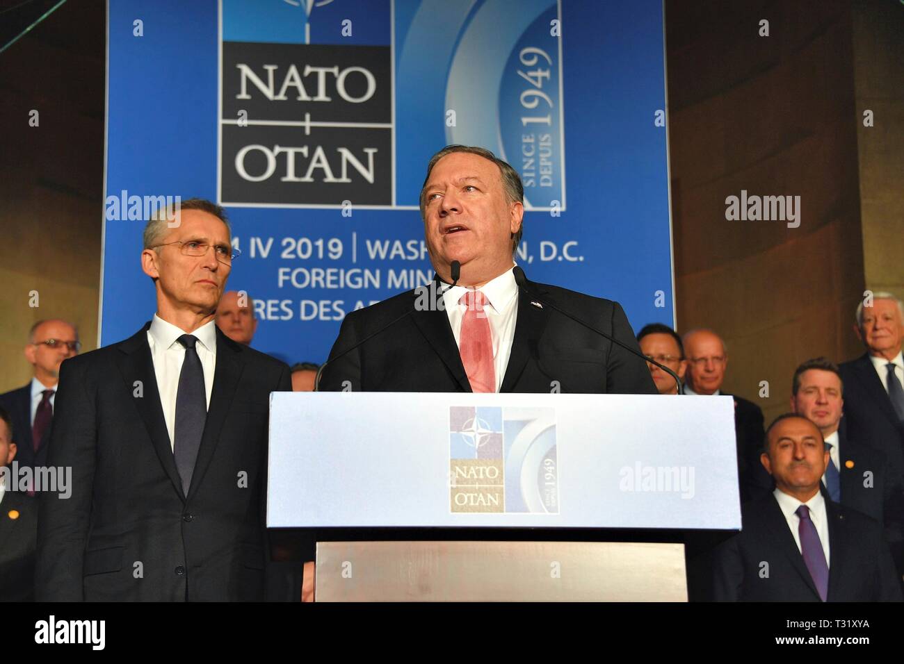 U.S. Secretary of State Mike Pompeo delivers remarks at a reception to celebrate NATO's 70th Anniversary at Andrew W. Mellon Auditorium April 3, 2019 in Washington, D.C. NATO Secretary General Jens Stoltenberg, left, stands next to Pompeo. Stock Photo