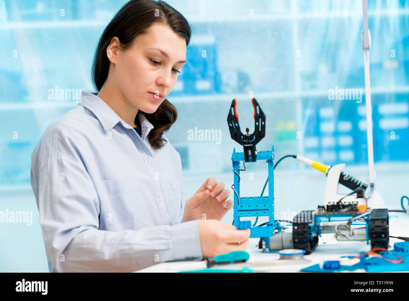 Young woman in CNC and robotics laboratory Stock Photo - Alamy