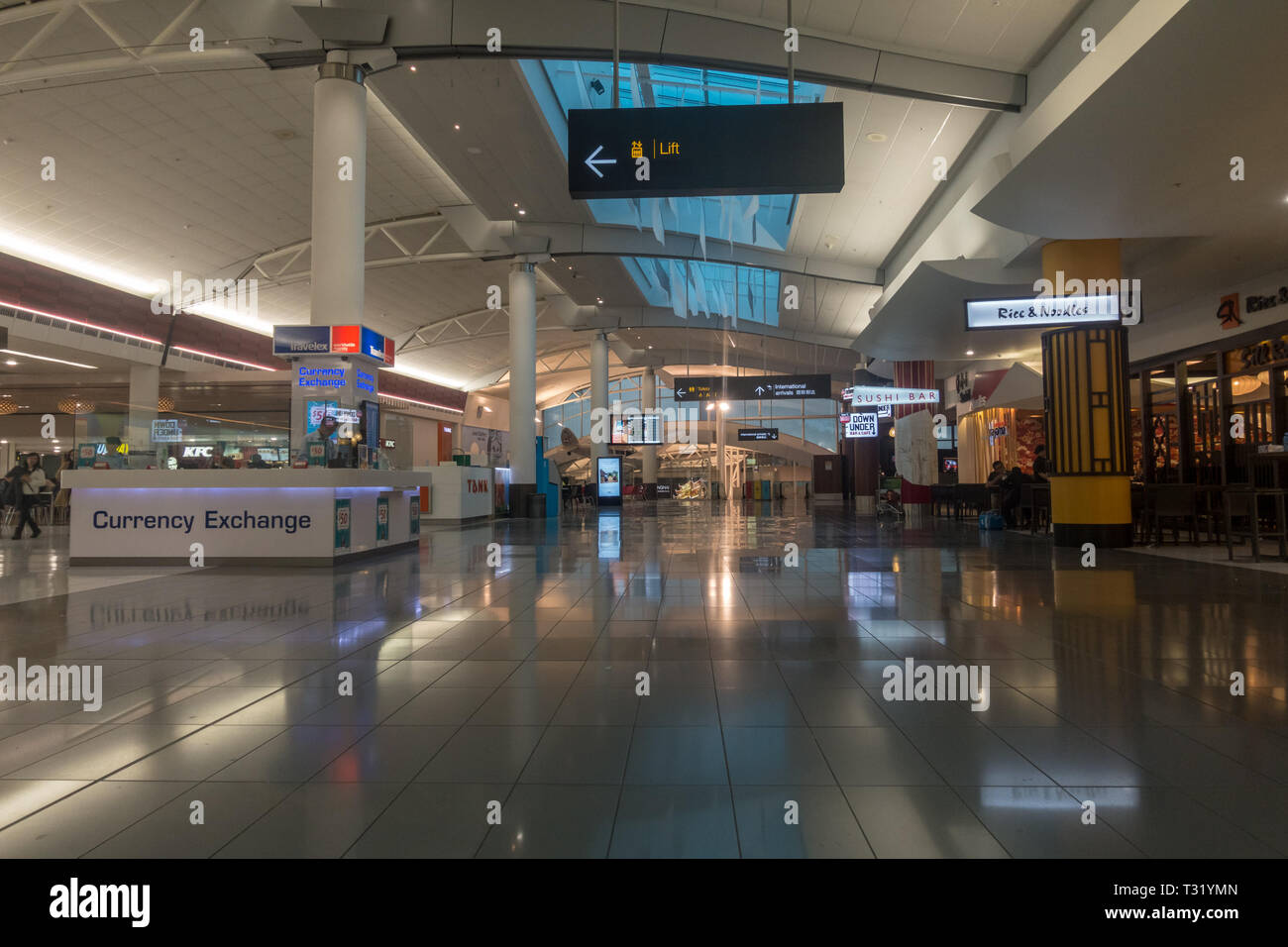 AUCKLAND - DEC 15 2016: Passengers passing through the new Auckland airport Stock Photo