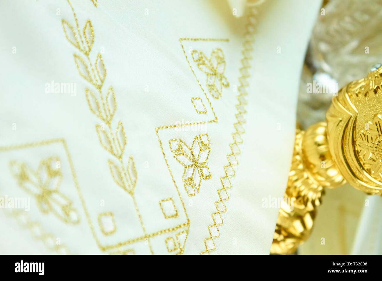 royal golden embroidery on white towel Stock Photo