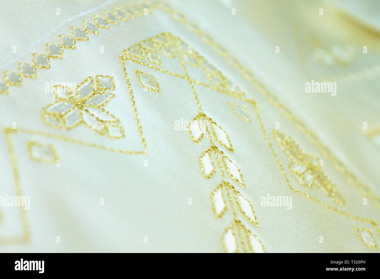 royal golden embroidery on white towel Stock Photo