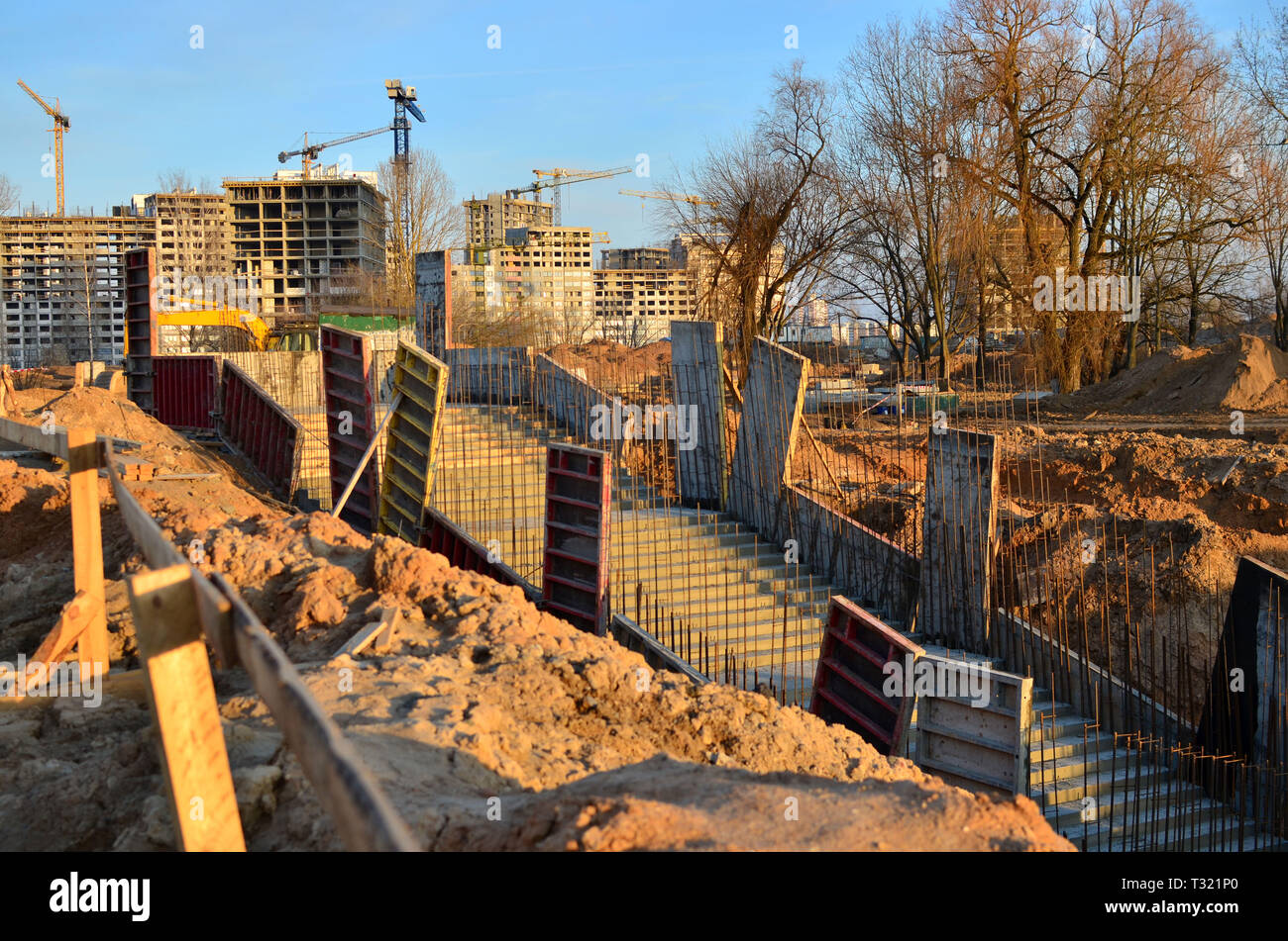 Monolithic concrete structure in the foundation pit during the construction of a new underground pedestrian crossing in the subway Stock Photo
