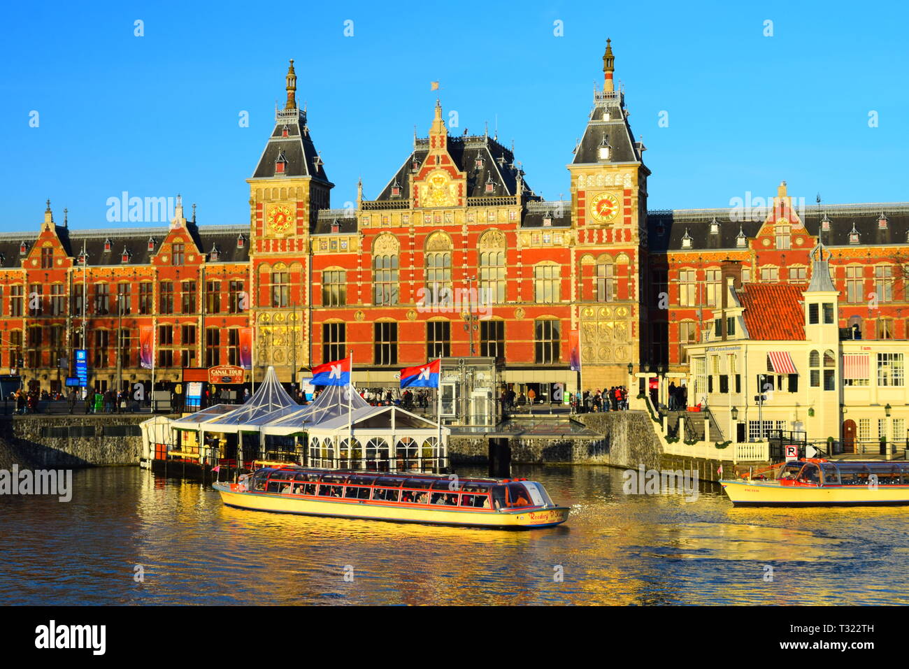 amsterdam - central train station and canal.winter 2019. Stock Photo