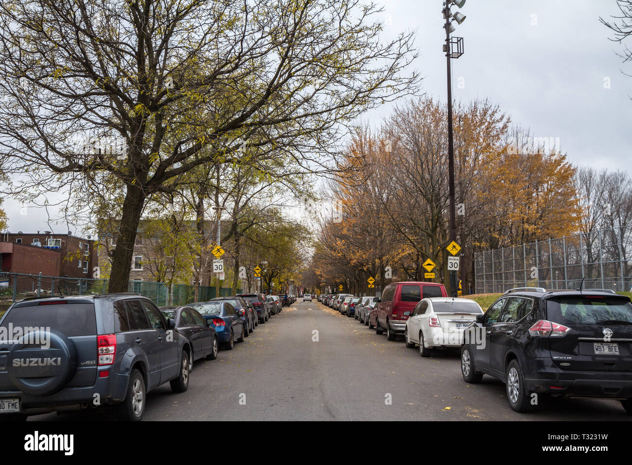 MONTREAL, CANADA - NOVEMBER 9, 2018: Typical north American residential street in autumn in Cote des Neiges Montreal, Quebec, during an autumn afterno Stock Photo
