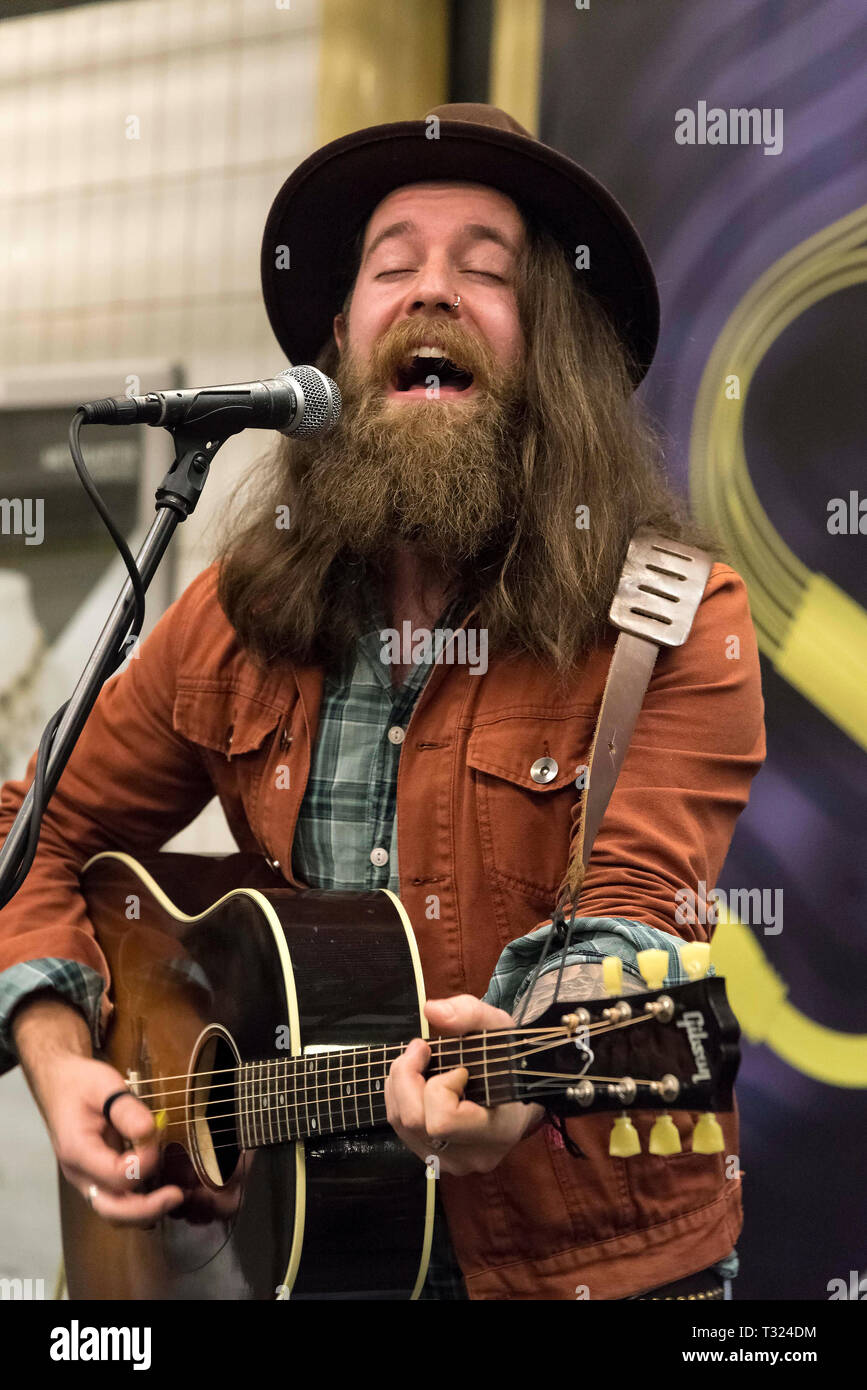 Bearded man playing guitar Stock Photo