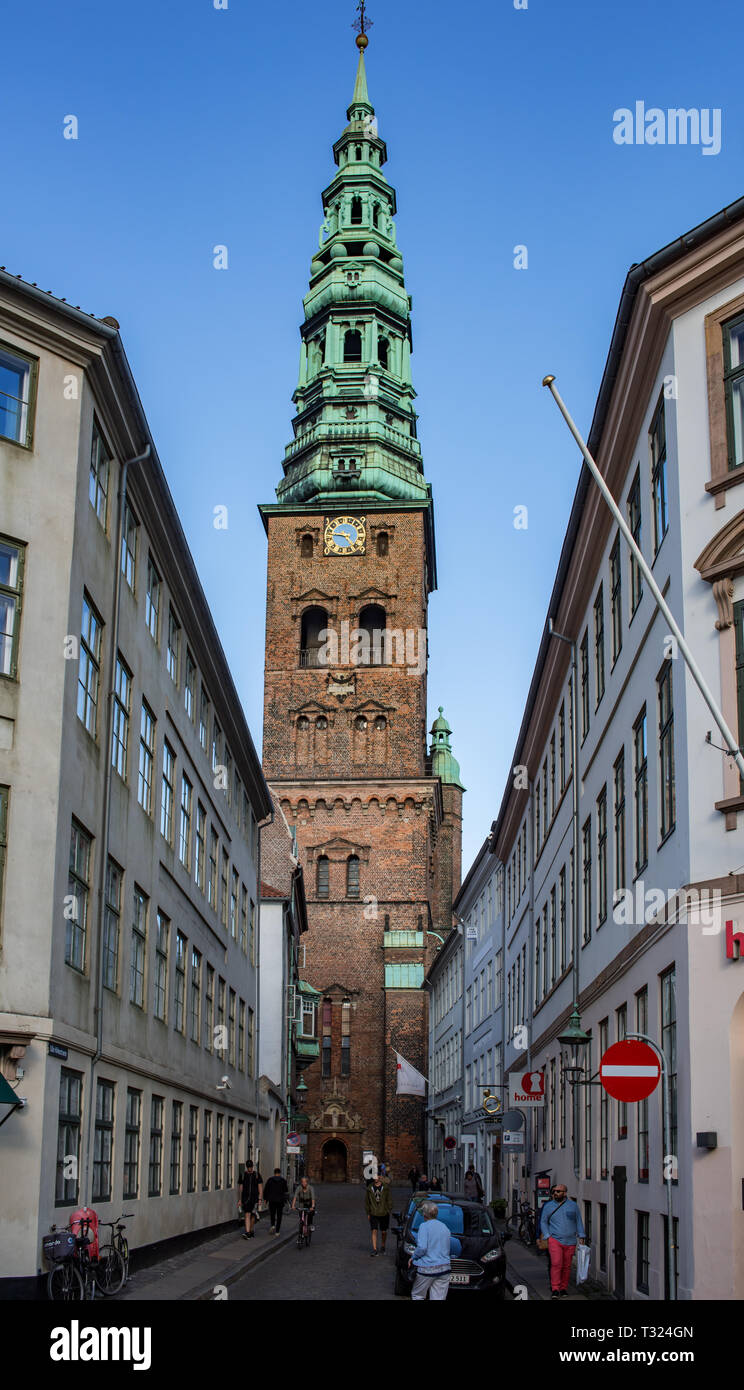 The tower and fanciful Neo-Baroque spire of the former St Nicholas Church, one of Copenhagen's most conspicuous landmarks.. It is now an arts centre. Stock Photo