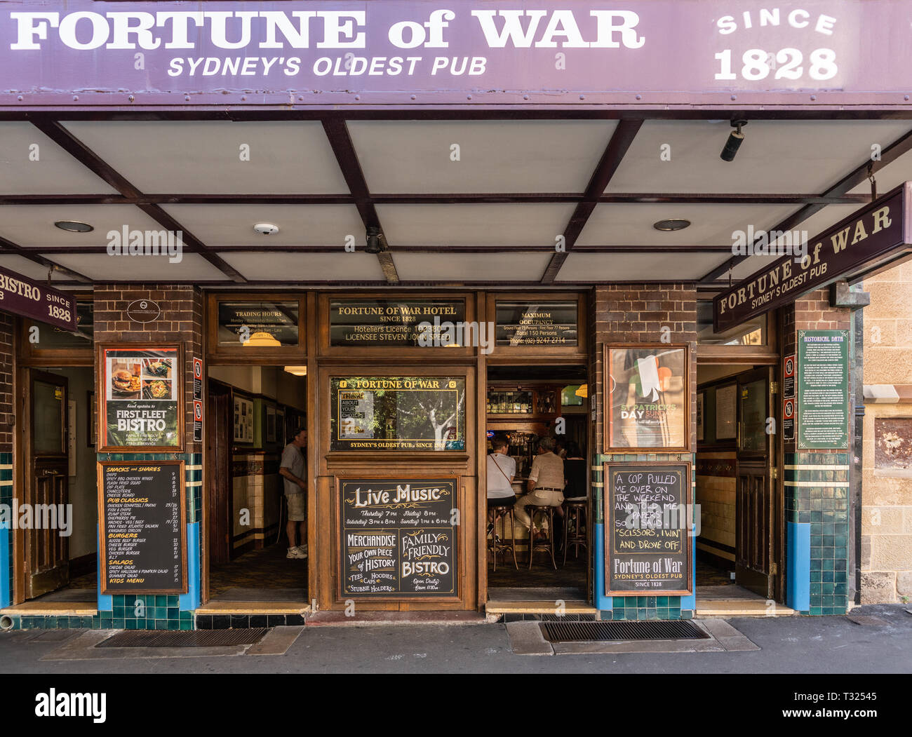 Sydney, Australia - February 11, 2019: Facade with look inside the Fortune of War, oldest pub in town in George Street near Circular Bay. Chalkboards  Stock Photo