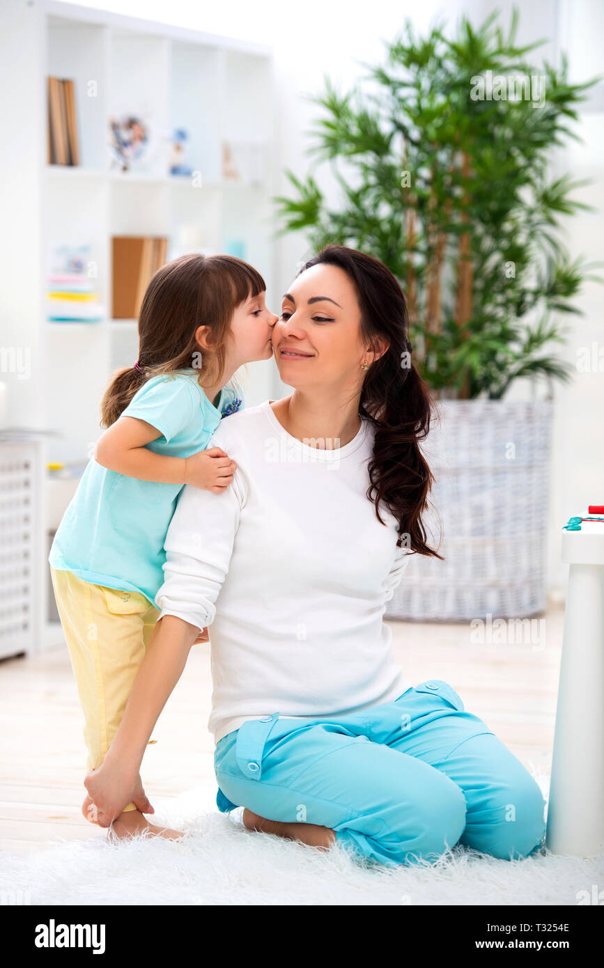 Little Daughter Hugs And Kisses Mom Happy Family And Love Mother S Day Stock Photo Alamy