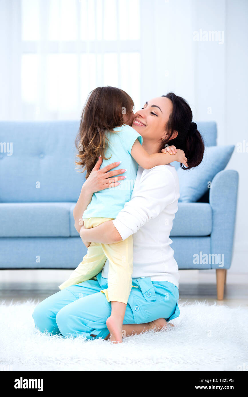 Little Daughter Hugs Mom Happy Family And Love Mother S Day Stock Photo Alamy