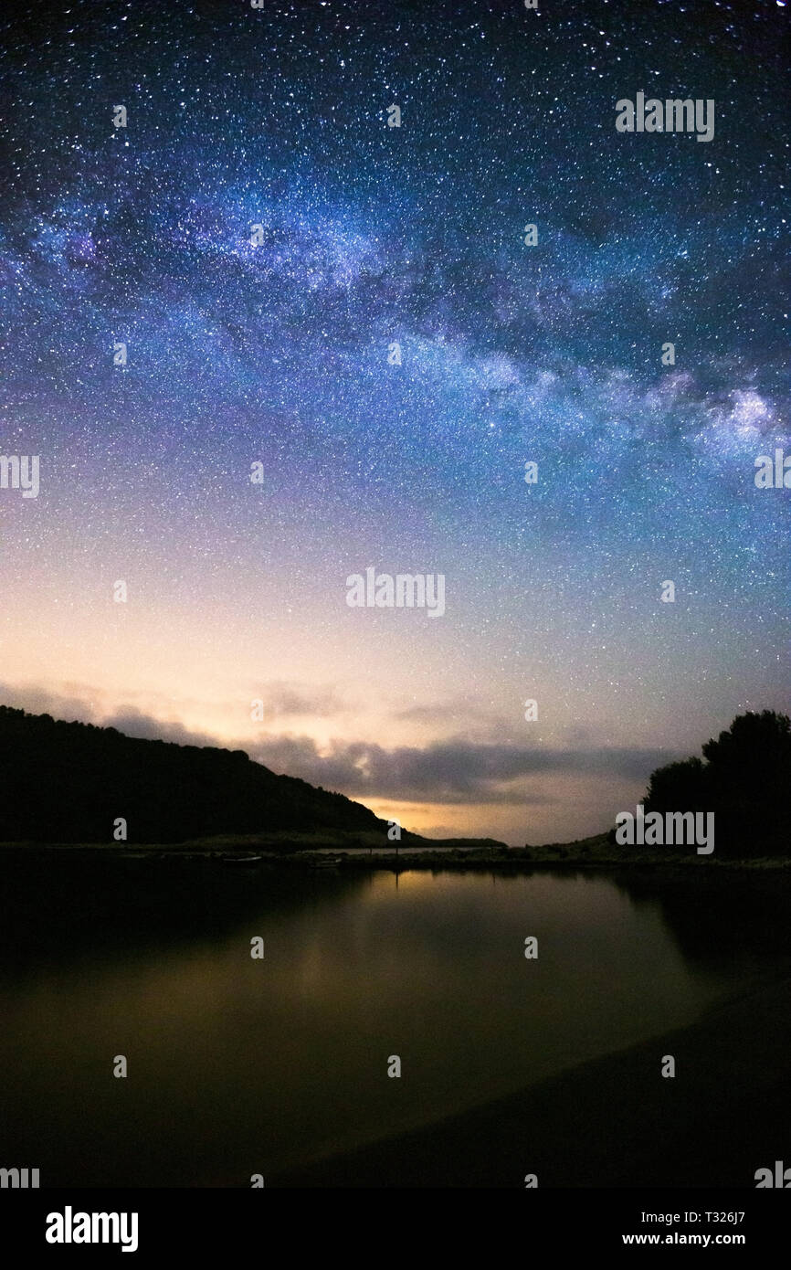Milky Way over Blace cove. Starry sky. Night sea landscape. Island Mljet, Adriatic sea. Croatia. Europe. Stock Photo