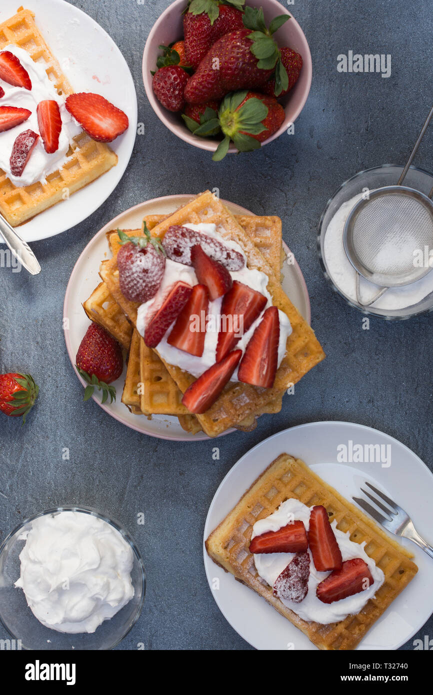 Waffles with strawberries and whipped cream Stock Photo - Alamy