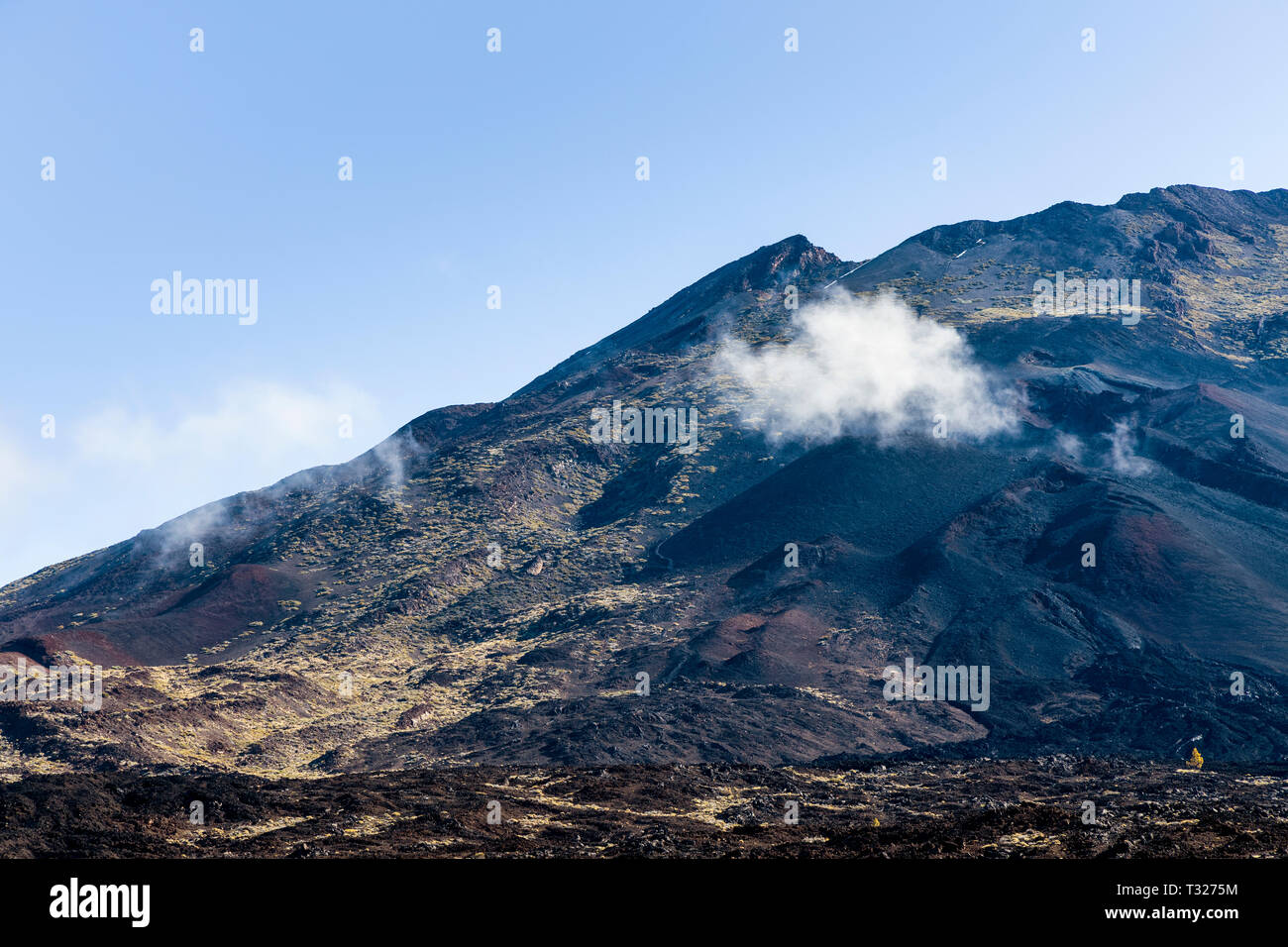 Small cloud floating above the Narices del teide, Teides nostrils, volcanic vent in the side of the Pico viejo, old peak, in the Las Canadas del Teide Stock Photo
