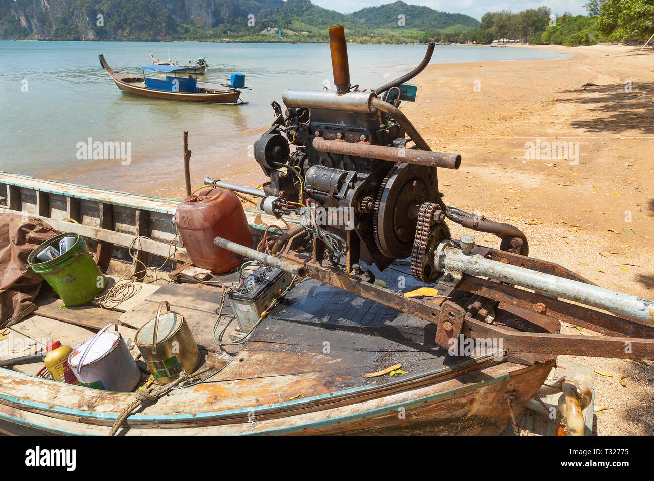 Thailand, long tailed boat on beach, view showing the engine used. Stock Photo