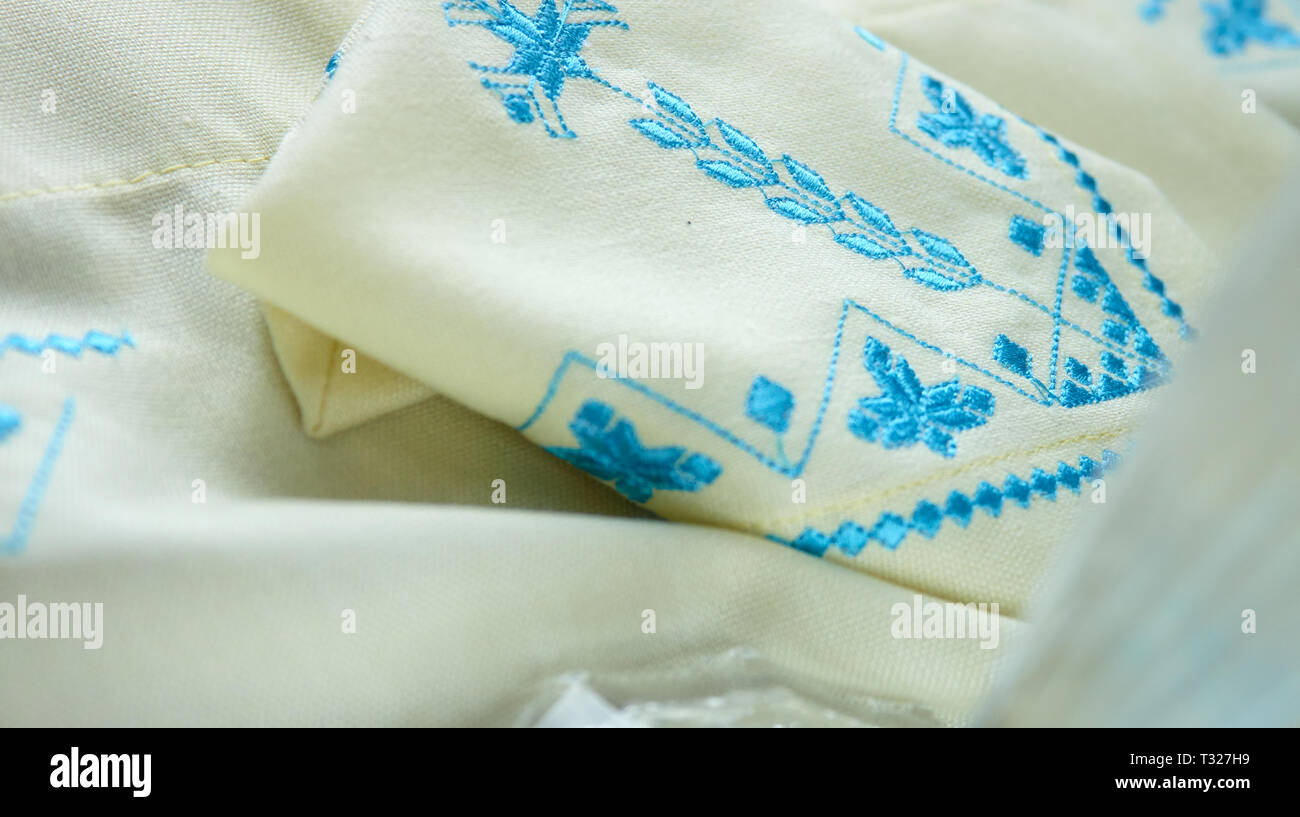 blue embroidery on white kitchen towel Stock Photo