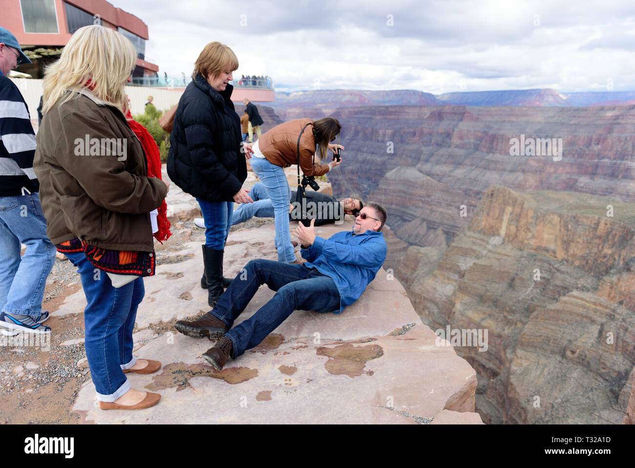 GRAND CANYON - February 19: Tourists take pictures at Eagle Point at Grand Canyon West Rim on February 19, 2017 in Grand Canyon, AZ Stock Photo
