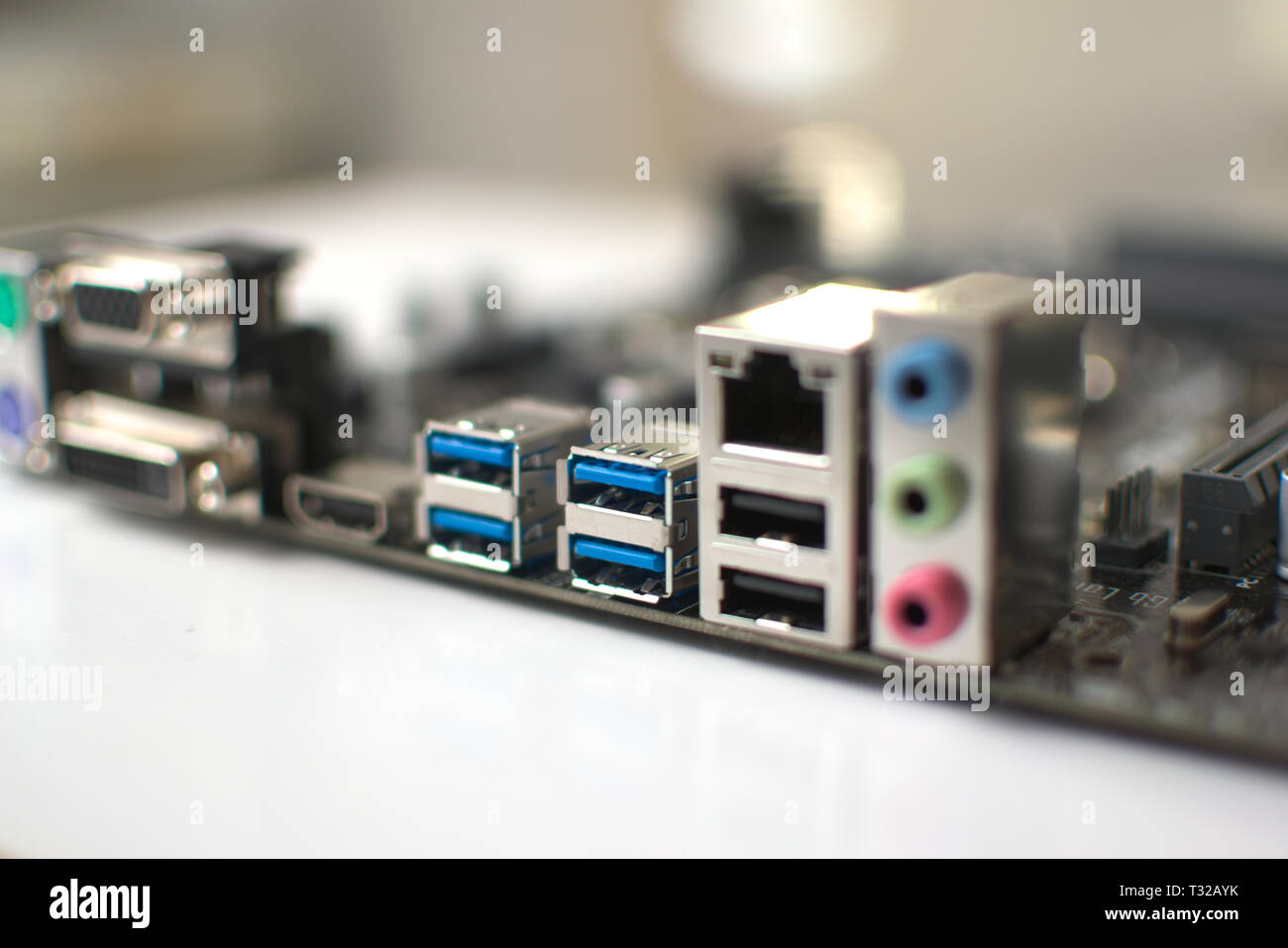 Modern computer ATX format motherboard. Back ports can be clearly seen. Stock Photo
