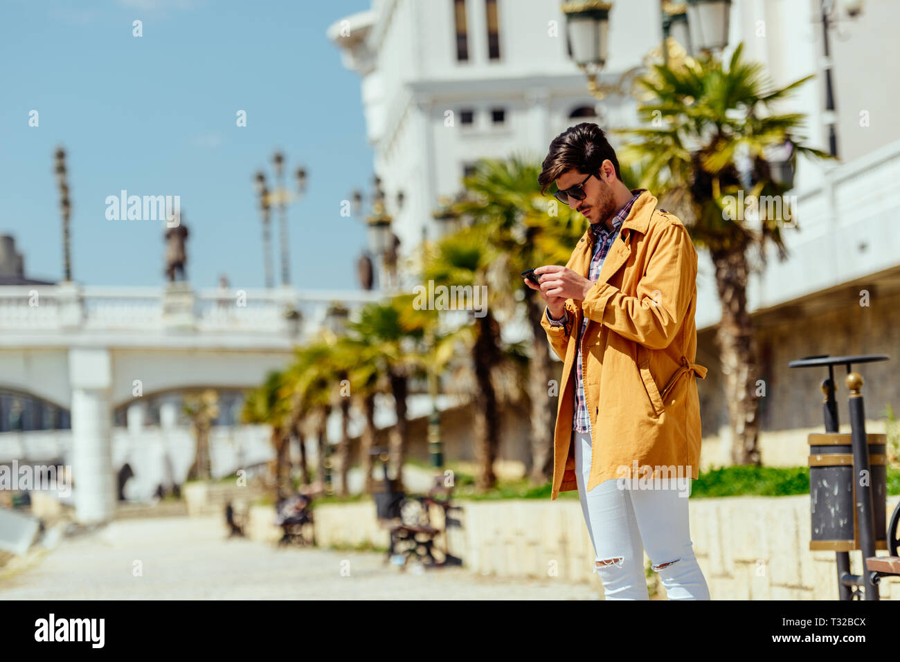 Typing message handsome young hi-res stock photography and images - Alamy