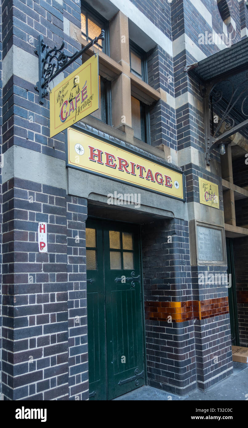 Sydney, Australia - February 12, 2019: Entance and facade to Belgian Beer Cafe Heritage in Harrington Street. Red on Yellow advertisements. Stock Photo