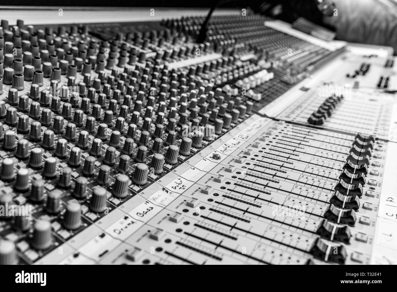 Analog sound mixing console used to mix microphones Stock Photo
