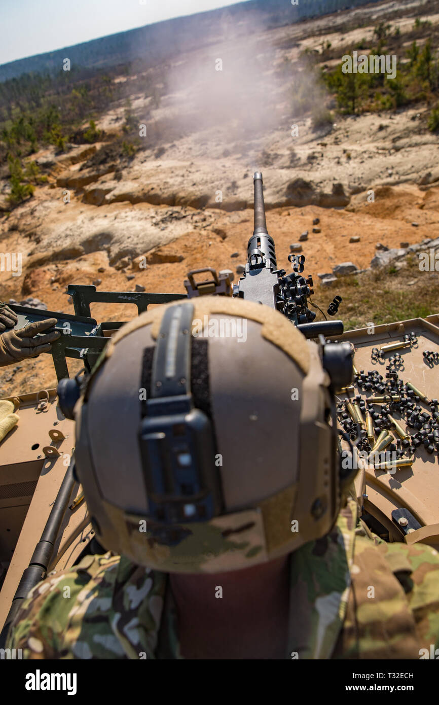A Green Beret assigned to 3rd Special Forces Group (Airborne) fires the M2 .50 caliber machine gun, April 2, 2019 at Fort Bragg, NC. Green Berets fired multiple weapon systems during the live fire range to include the M240B machine gun, M320 grenade launcher and the M249 Squad Automatic Weapon. (U.S. Army photo by Sgt. Steven Lewis) Stock Photo