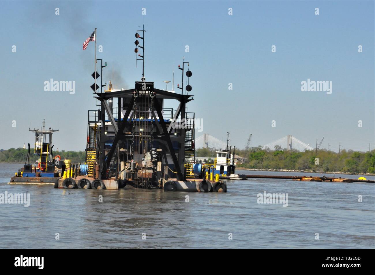 The dredge Hampton Roads with its submerged cutter head helps keep the Savannah River at its authorized depth of 42 feet. The U.S. Army Corps of Engineers, Savannah District oversees maintenance dredging in the Savannah Harbor. Stock Photo
