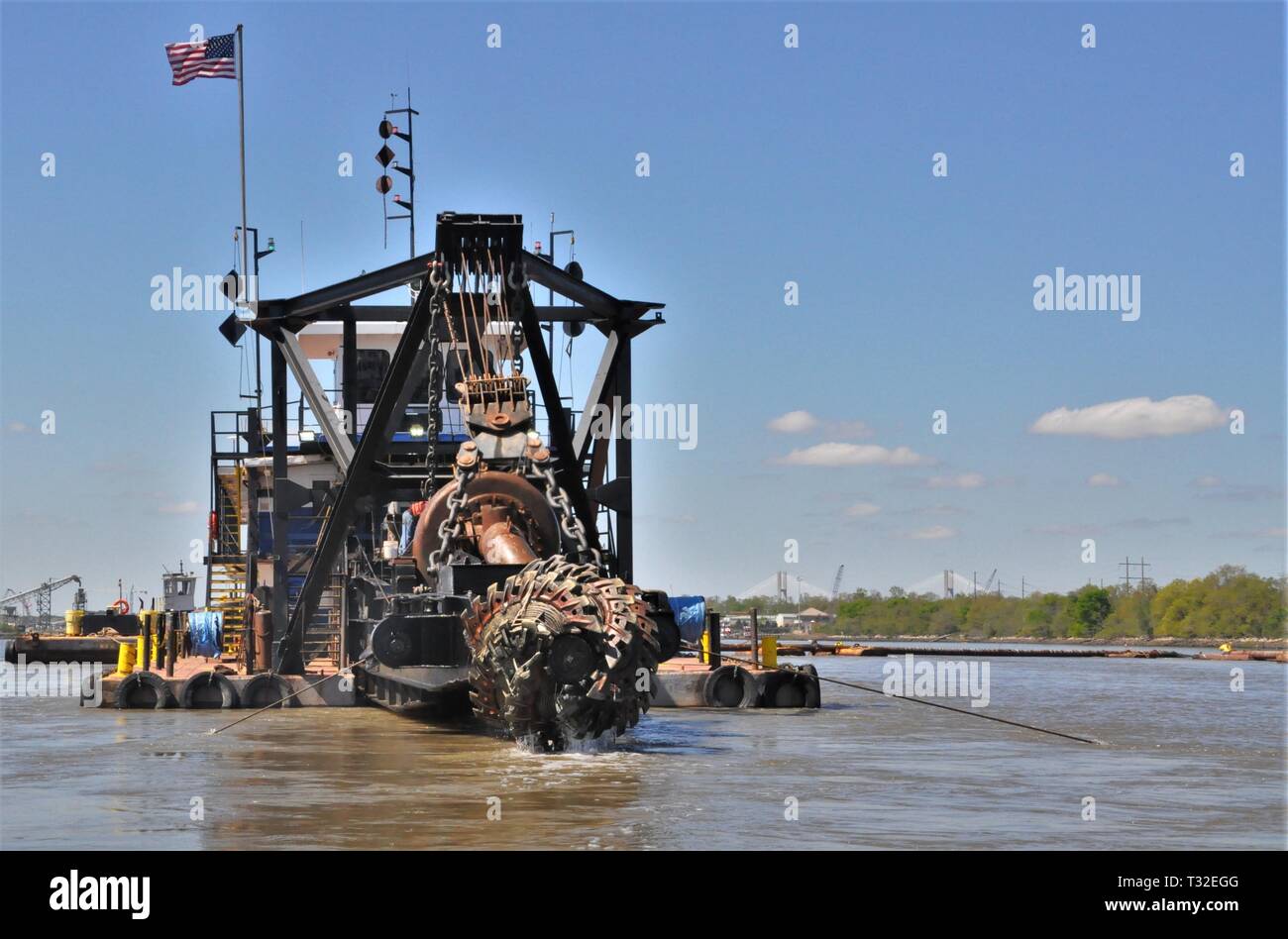 The dredge Hampton Roads raises its cutter head for maintenance during Savannah River maintenance dredging operations overseen by the U.S. Army Corps of Engineers, Savannah District. Stock Photo