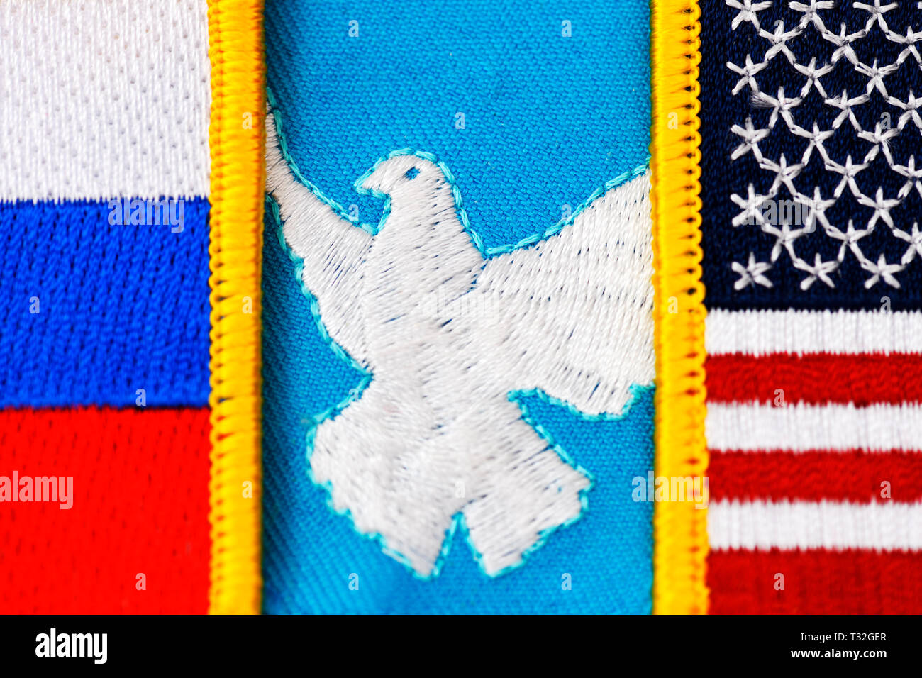 Dove of peace between the flags of the USA and Russia, Aufkündigung of the INF contract and danger for the peace, Friedenstaube zwischen den Fahnen vo Stock Photo